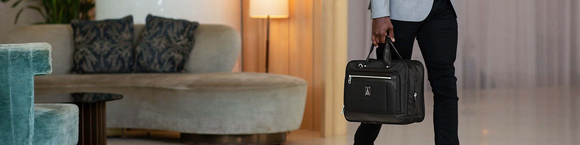 man holding a briefcase in hotel lobby