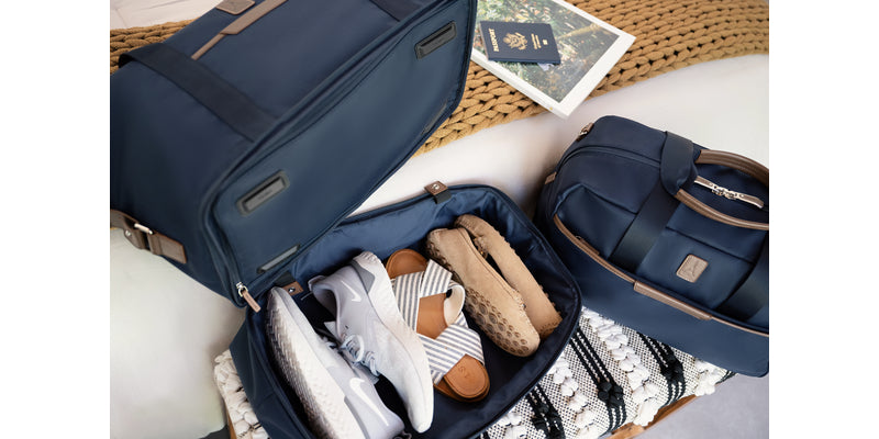 Weekender bag open with shoes and clothes inside