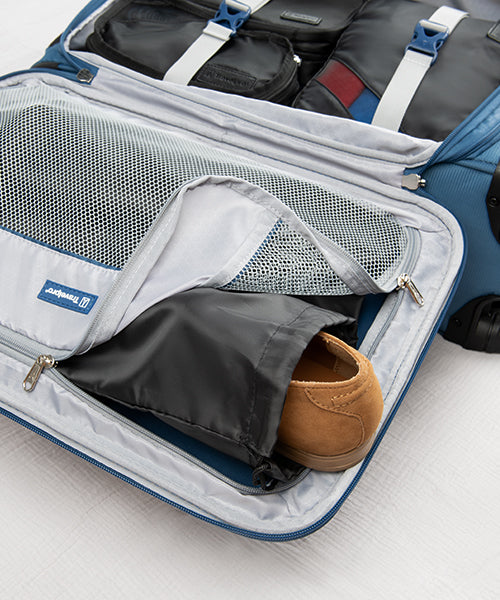 Shoe bags being packed in the zippered compartment